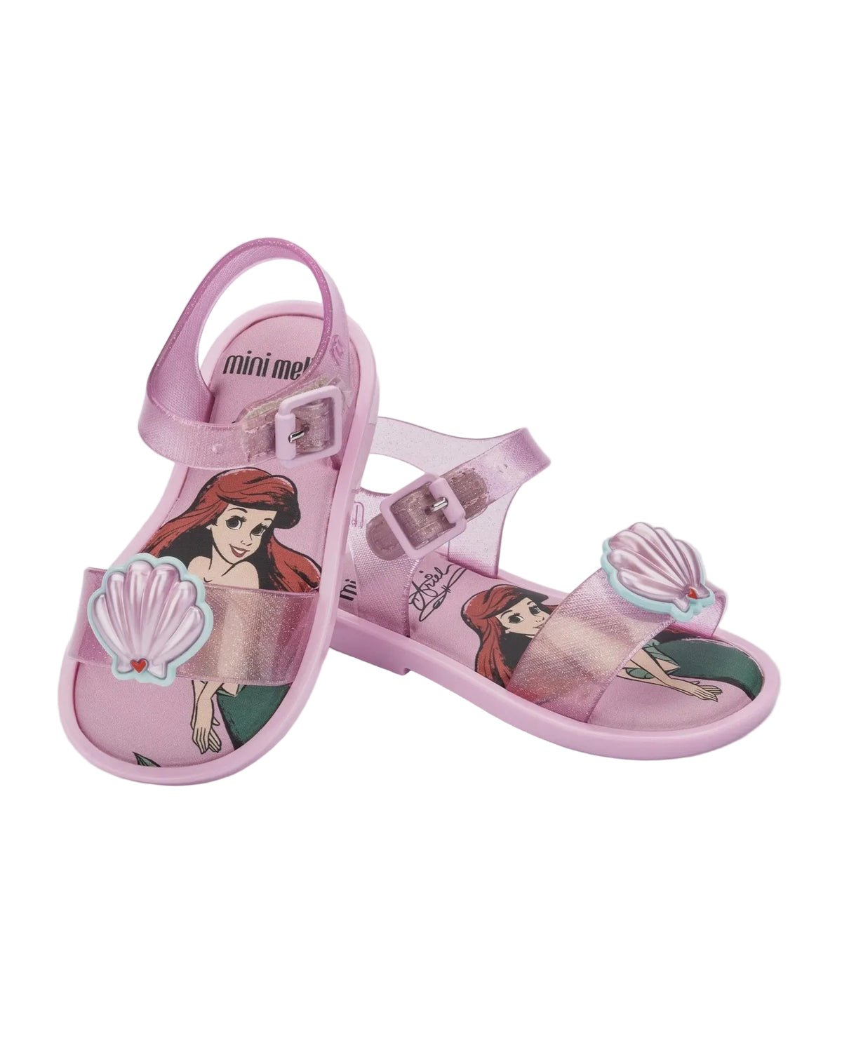 Pink glitter jelly sandals with adjustable ankle straps, featuring Disney's Ariel and a 3D seashell embellishment.
