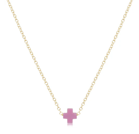 Delicate gold chain necklace with a small, flat, light pink cross pendant centered on a white background.