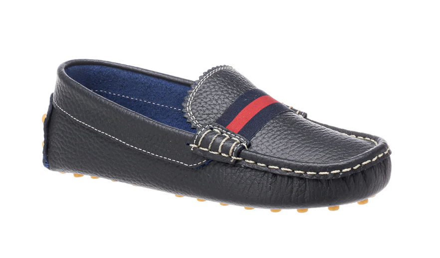 Children's navy blue textured leather driving loafer with white contrast stitching, a red and blue striped vamp band, and tan rubber sole nubs.