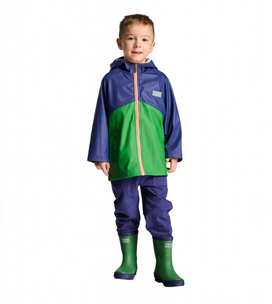 Boy wearing a navy and green colorblock zip-up rain jacket with hood and orange zipper, front view