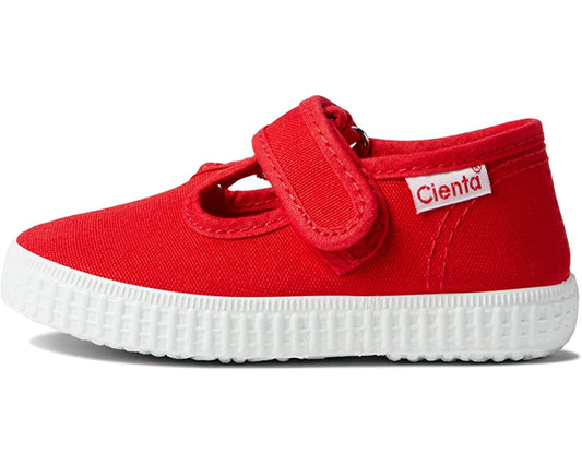 Red canvas Cienta T-strap shoe with a white textured rubber sole and Velcro closure.