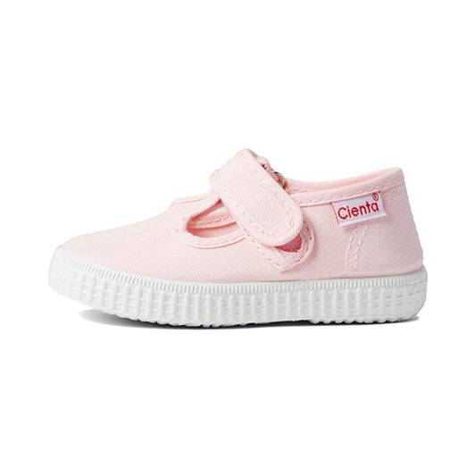 A light pink Cienta Classic T-Strap children's shoe with a white ribbed sole and a Velcro closure.