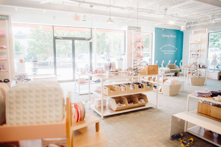 Sprong store accessories displays with headbands, bows, and giftables