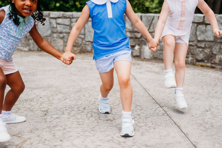Children jumping in athletic sneakers