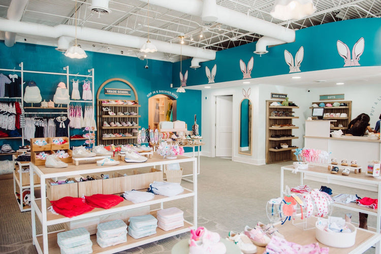 Sprong store interior with apparel and accessory tables