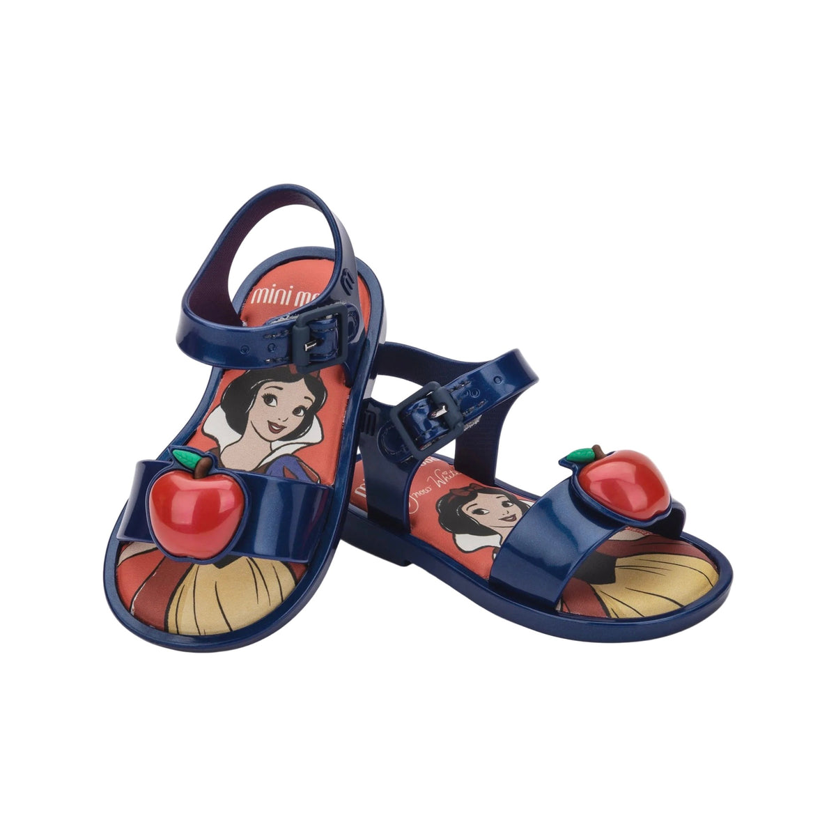 Pair of shiny dark blue Mini Melissa children's sandals featuring Snow White and a red apple on the insole, with a 3D red apple on the toe strap.