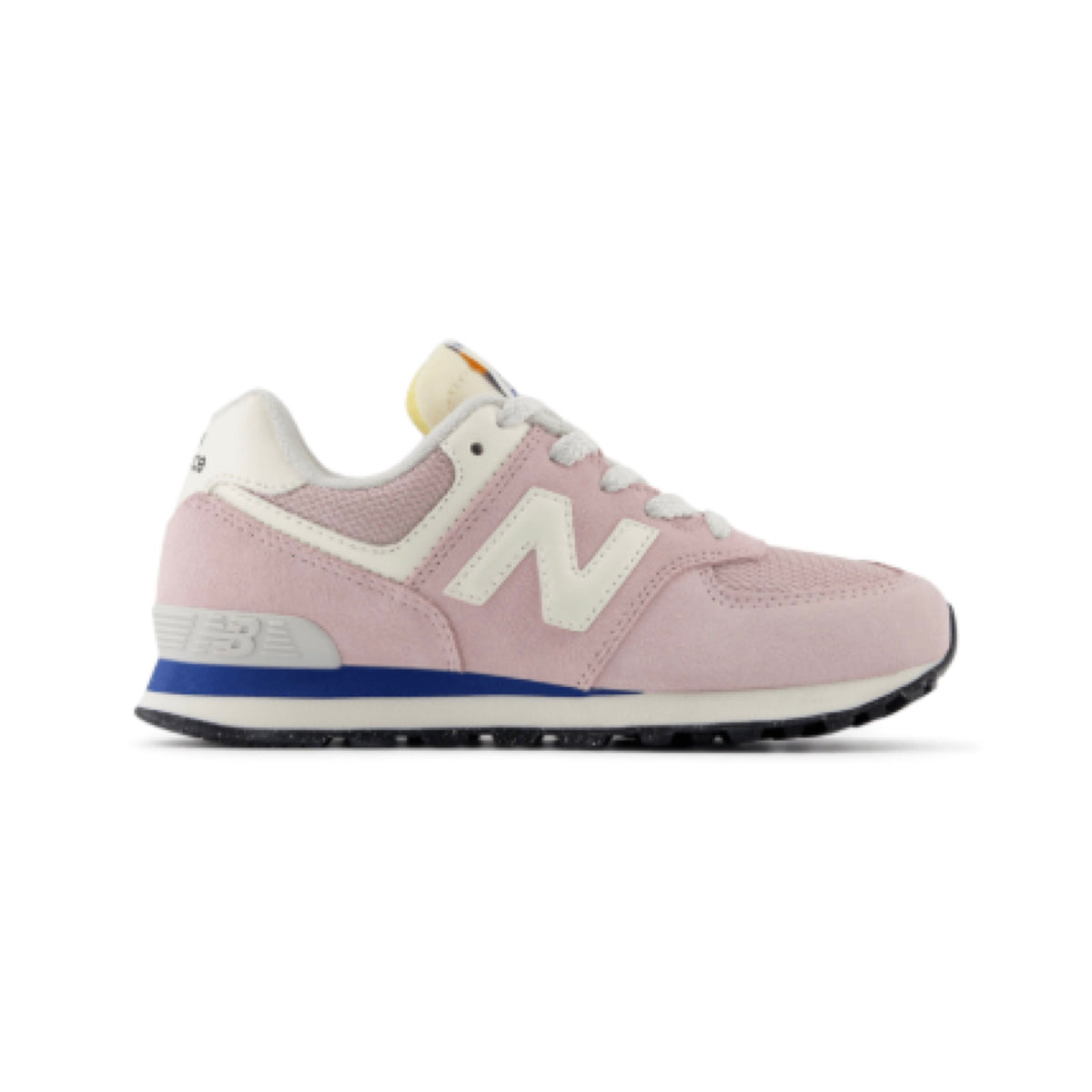 New Balance 574 children's sneaker in light pink suede and mesh with cream accents, a blue midsole stripe, and black outsole.