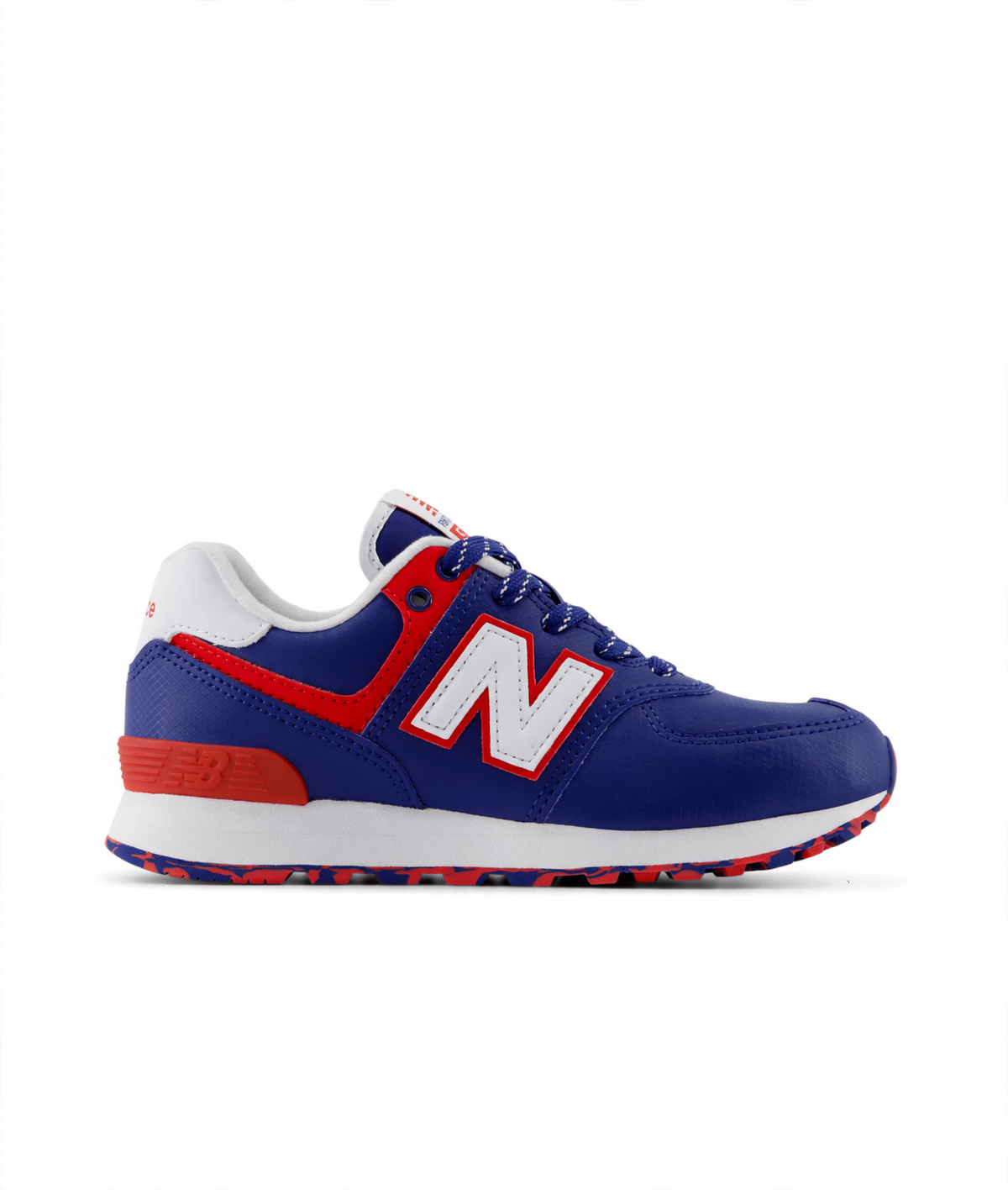 New Balance 574 Core Lace little kids' sneaker in blue with red accents, white 'N' logo, white midsole, and patterned outsole.