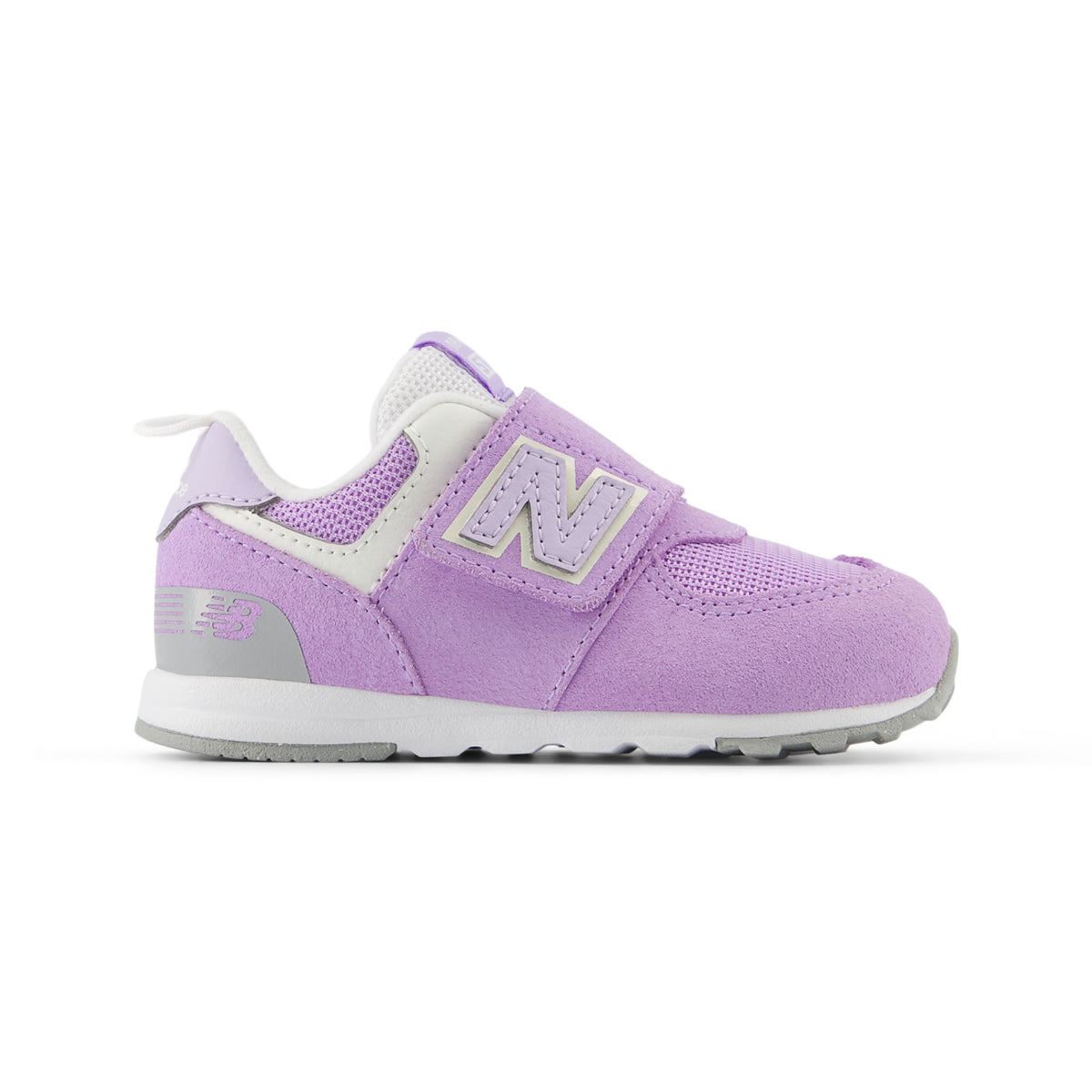 Children's New Balance 574 sneaker in lavender, white, and grey, featuring a hook-and-loop closure with a large 'N' logo.