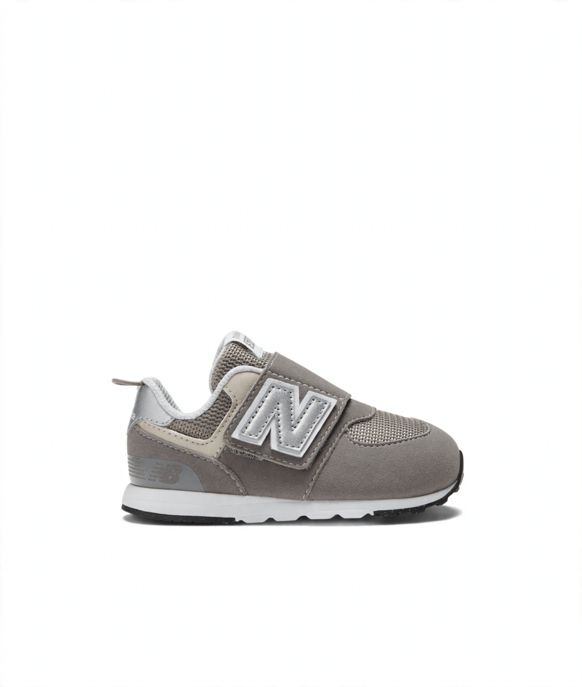 Grey New Balance 574 children's sneaker featuring a silver N logo, hook-and-loop strap, and white midsole.