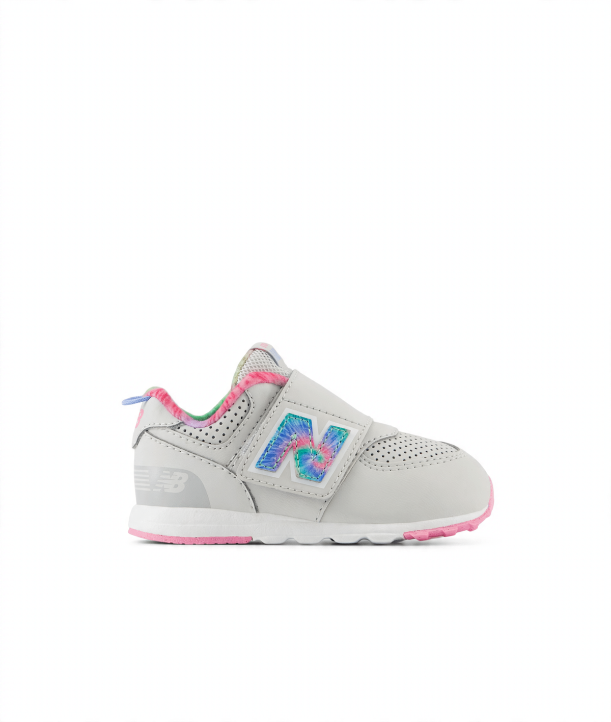 Light gray New Balance 574 children's sneaker with a tie-dye 'N' logo, pink accents, and a hook-and-loop closure.