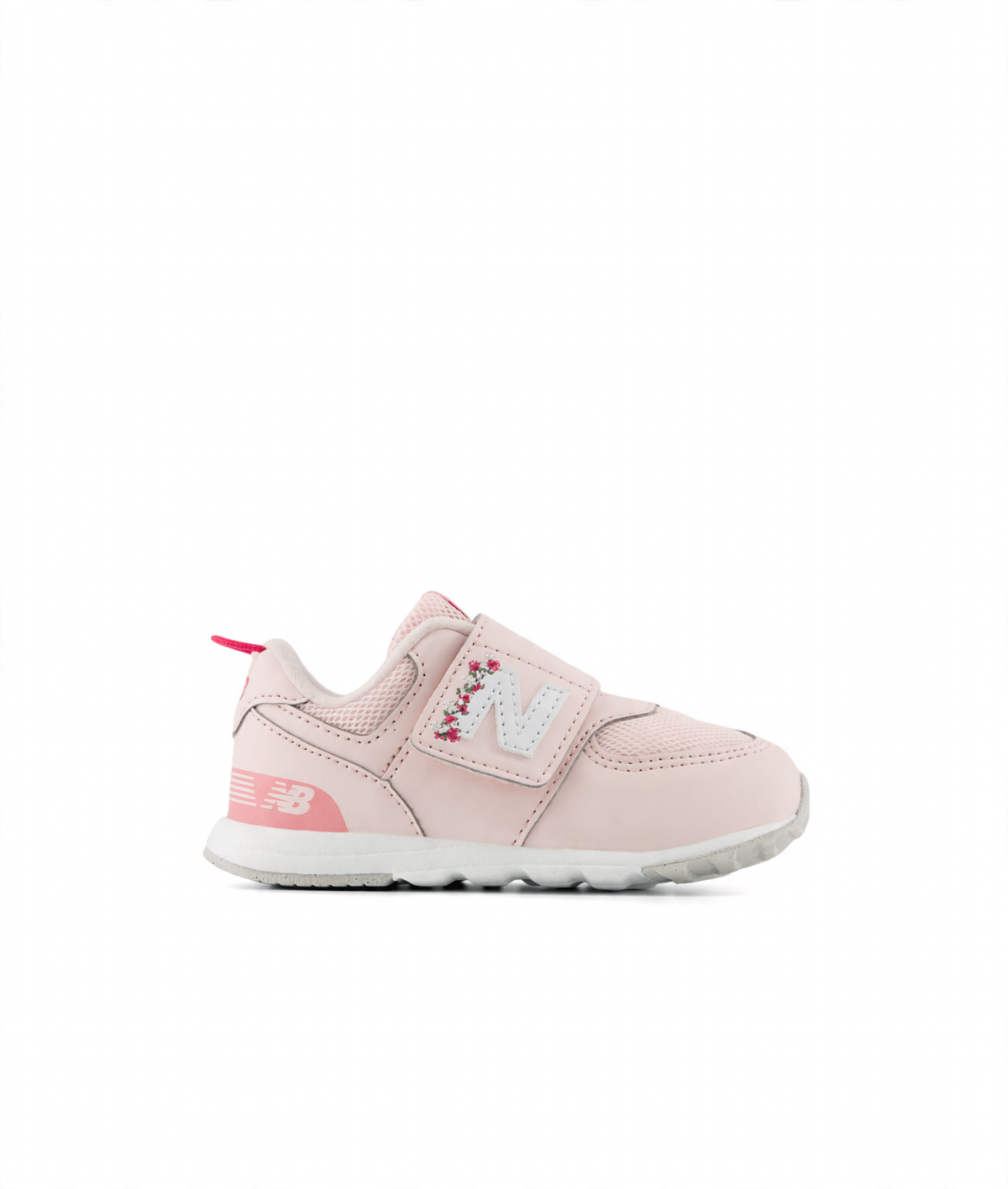 Pink New Balance children's sneaker with hook and loop closure, white 'N' logo with floral embroidery, and a pink pull tab.