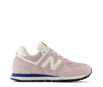 New Balance 574 children's sneaker in light pink suede and mesh with cream accents, a blue midsole stripe, and black outsole.