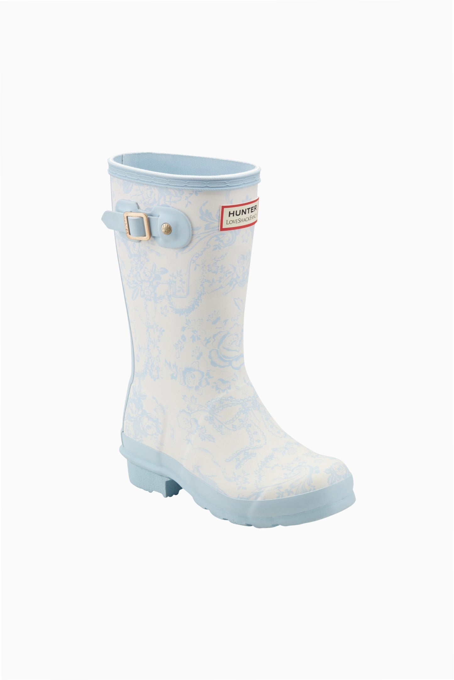 Children's Hunter x LoveShackFancy rain boot in white with a light blue floral pattern, light blue sole, and an adjustable side buckle.