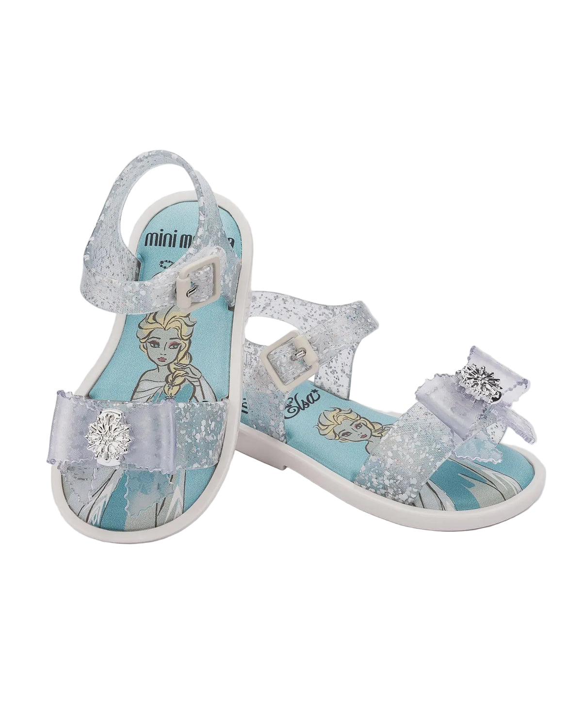 Pair of glittery clear and light blue Disney Frozen Elsa sandals with snowflake embellishments and white soles.