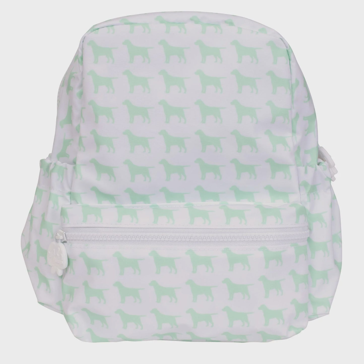 White backpack with a light green dog silhouette pattern, featuring a front zipper pocket with a dog-shaped pull and side elasticated pockets.