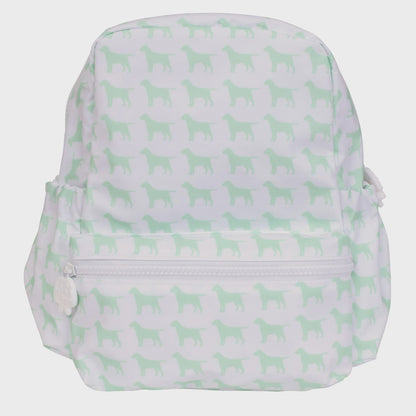 White backpack with a light green dog silhouette pattern, featuring a front zipper pocket with a dog-shaped pull and side elasticated pockets.
