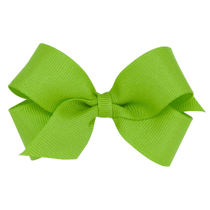 A bright green grosgrain ribbon bow with a plain wrap in the center, isolated on a white background.