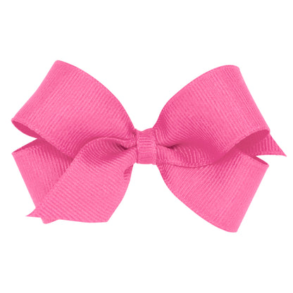 Bright pink grosgrain ribbon bow with a ribbed texture, tied neatly in the center.