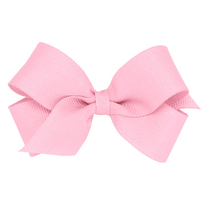 Light pink grosgrain bow with a ribbed texture and a plain wrap in the center.