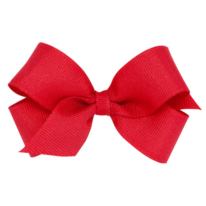 A vibrant red grosgrain ribbon bow with a ribbed texture, tied in a classic style.