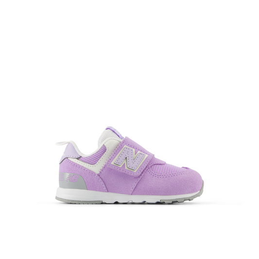 Children's New Balance 574 sneaker in lavender, white, and grey, featuring a hook-and-loop closure with a large 'N' logo.