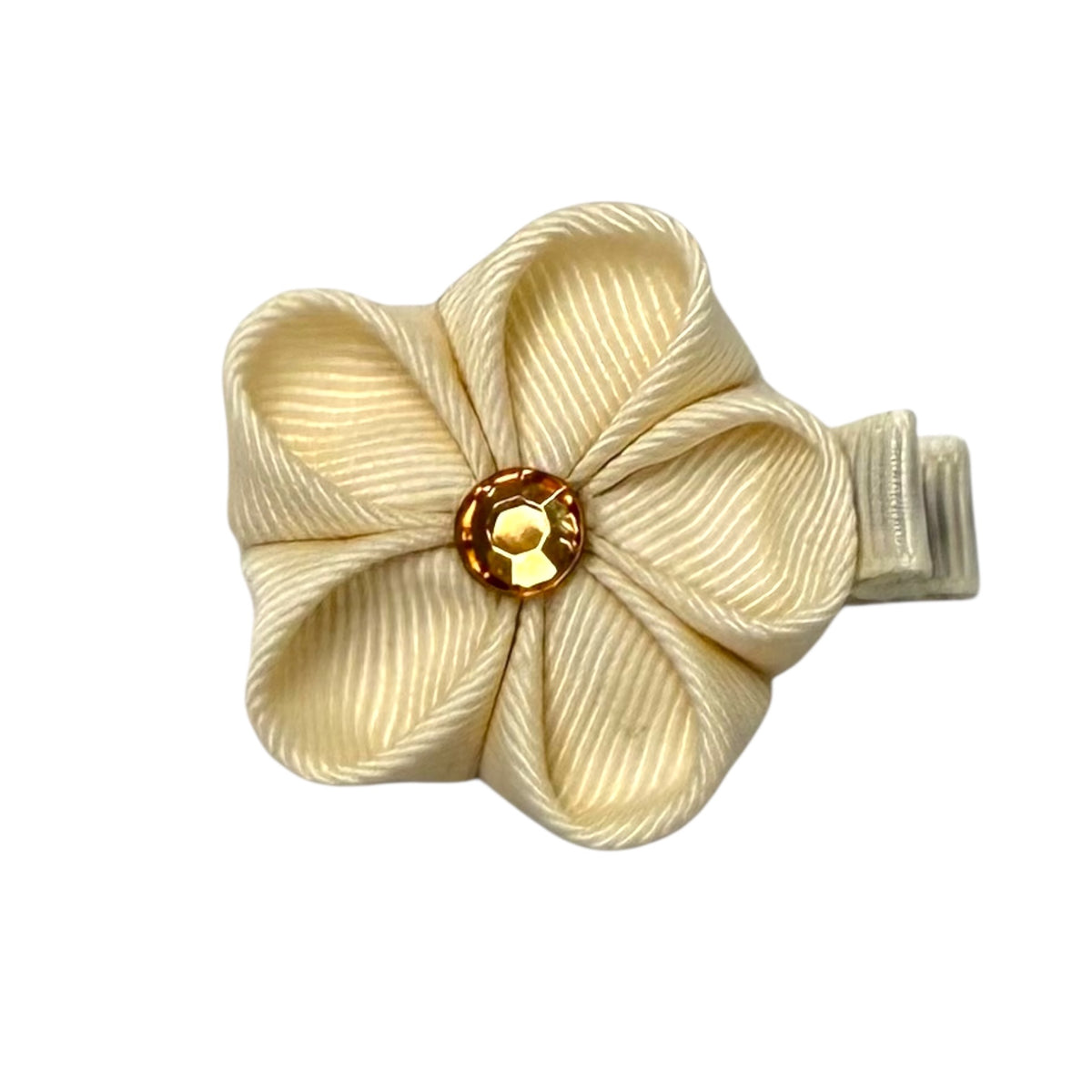 Cream fabric flower clip with a gold gem center and a ribbed texture, attached to a small hair clip.