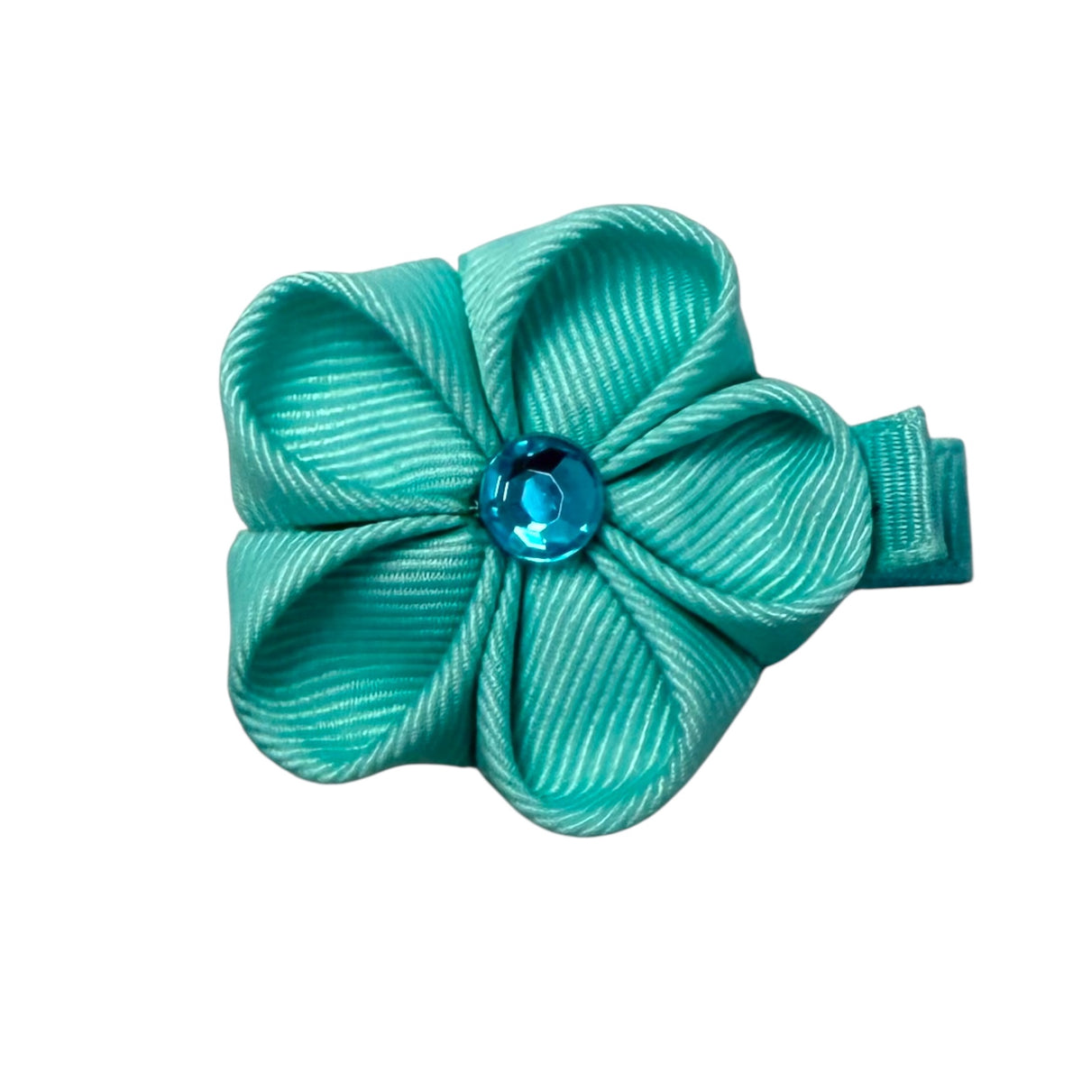 Teal ribbed ribbon flower clip with a faceted blue gem in the center, attached to a matching teal clip.