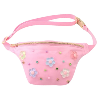 Pink fanny pack with a gold zipper and buckle, adorned with colorful translucent flower appliques and small beads.