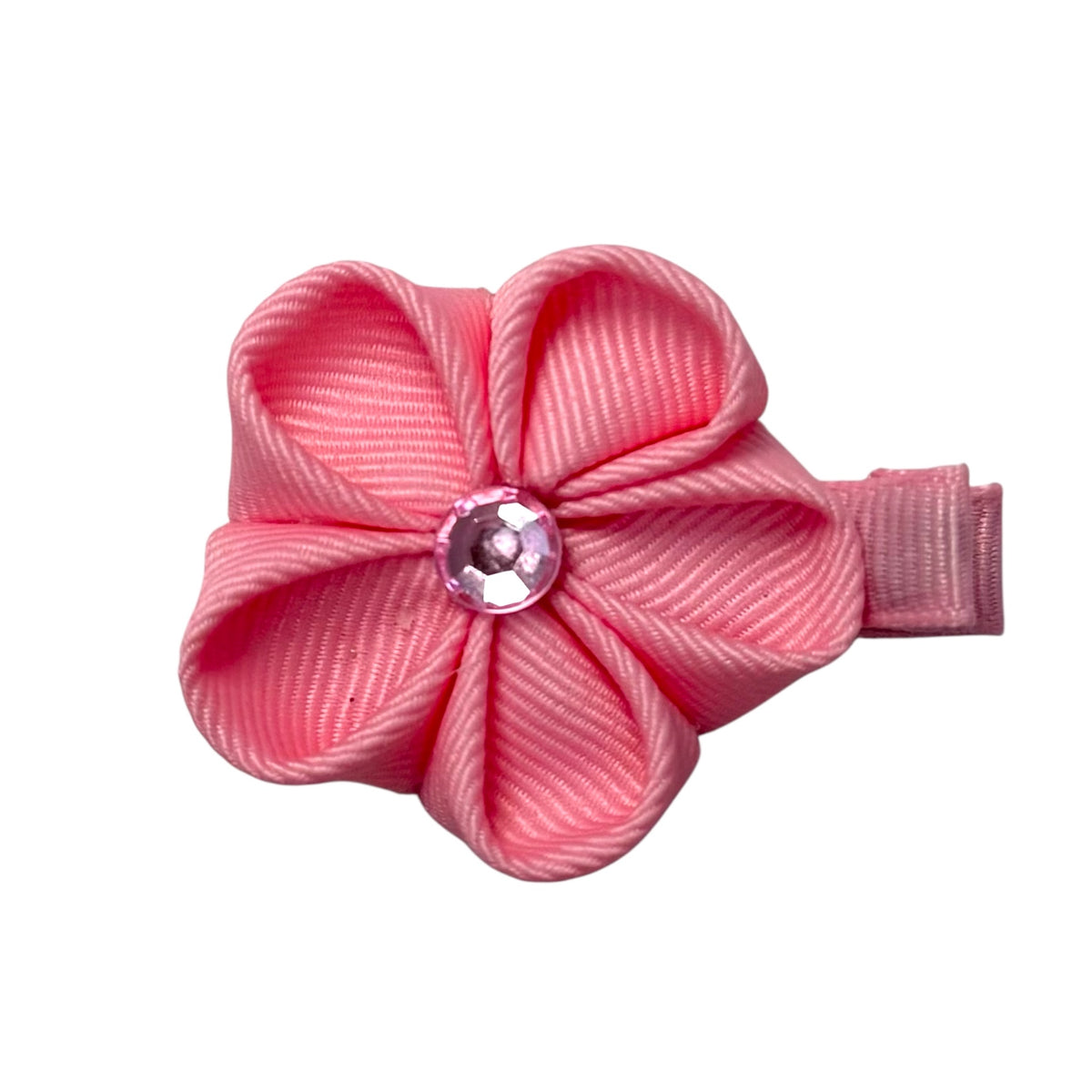 Pink ribbed ribbon flower hair clip with a sparkling pink gem in the center, attached to a small clip.