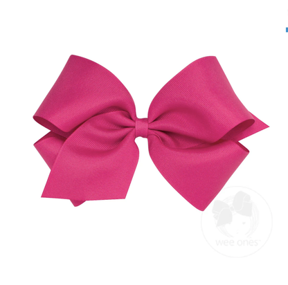 Large fuchsia grosgrain ribbon bow with layered loops and a central knot, perfect for hair accessories.