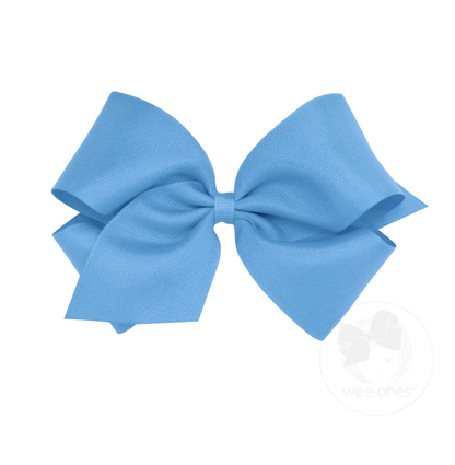 A large light blue grosgrain bow with a ribbed texture, tied in a classic shape.