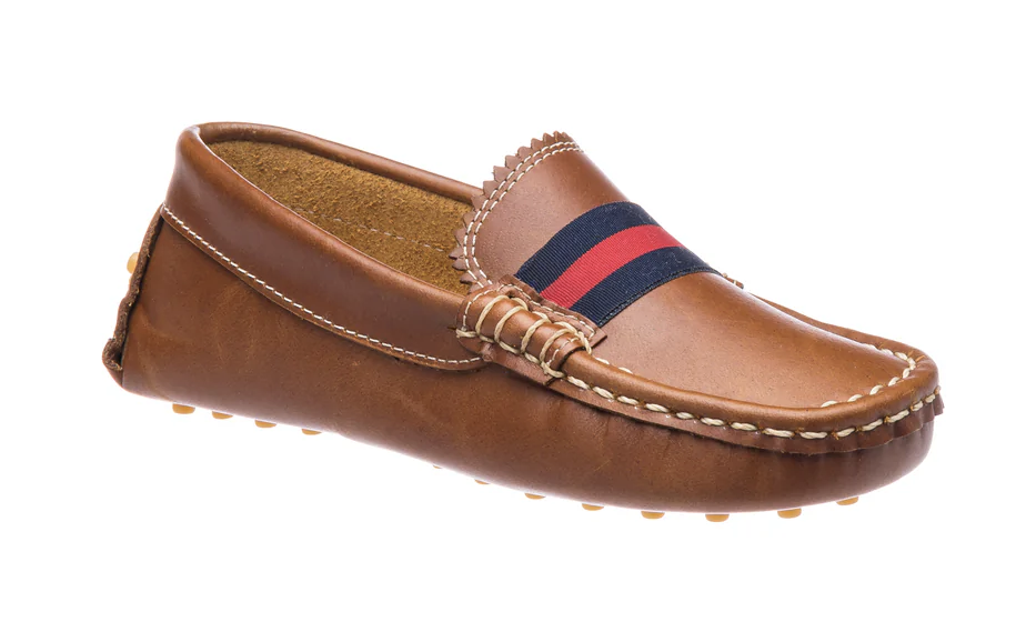 Children's brown leather driver loafer with red and navy stripe, white stitching, scalloped tongue, and rubber nub sole.