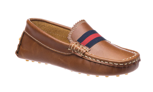 Children's brown leather driver loafer with red and navy stripe, white stitching, scalloped tongue, and rubber nub sole.