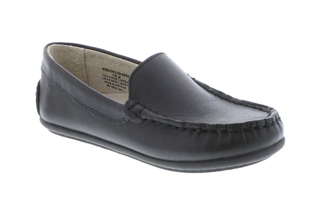 Single black leather Footmates Brooklyn Loafer with moc-toe stitching, viewed from a slightly elevated side angle.