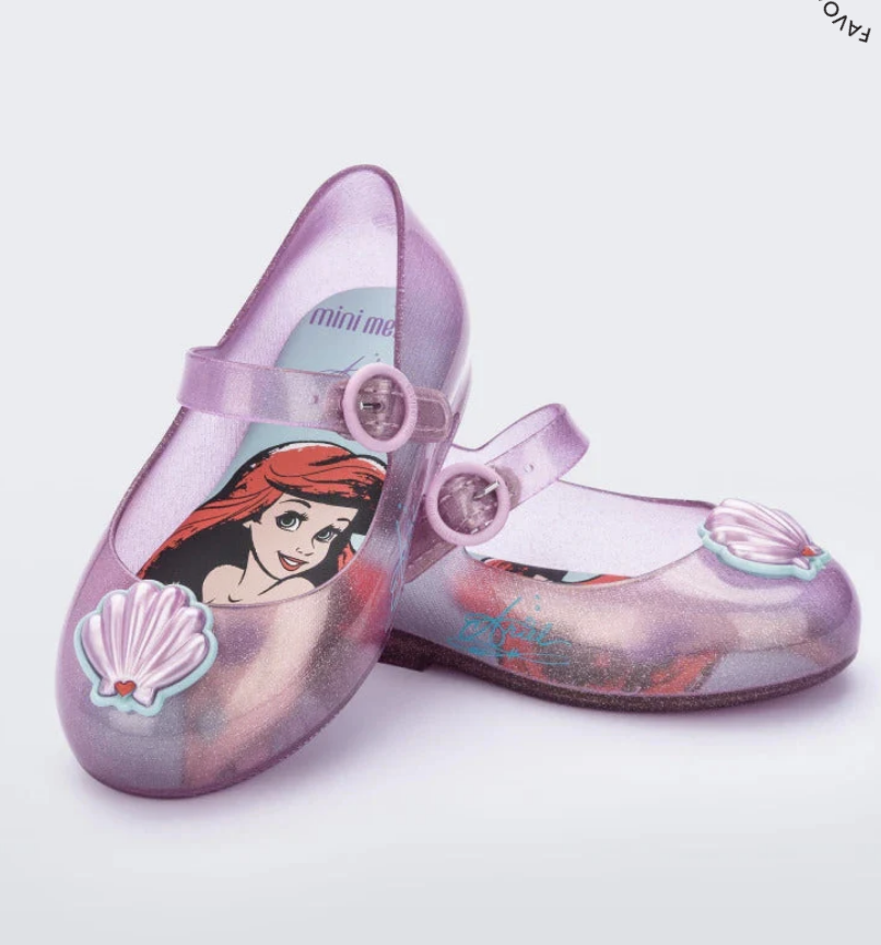 Glittery translucent purple Mini Melissa Mary Jane shoes featuring Ariel on the insole and seashell embellishments on the toes.