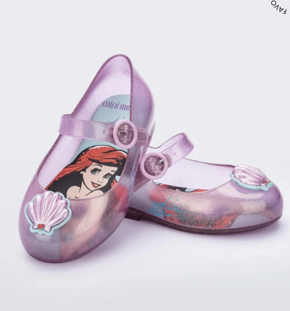 Glittery translucent purple Mini Melissa Mary Jane shoes featuring Ariel on the insole and seashell embellishments on the toes.