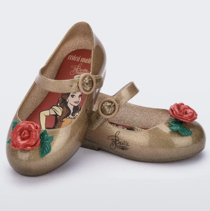 Sparkly gold Mary Jane style shoes with red rose accents, featuring Disney's Belle on the insole and a signature on the side.