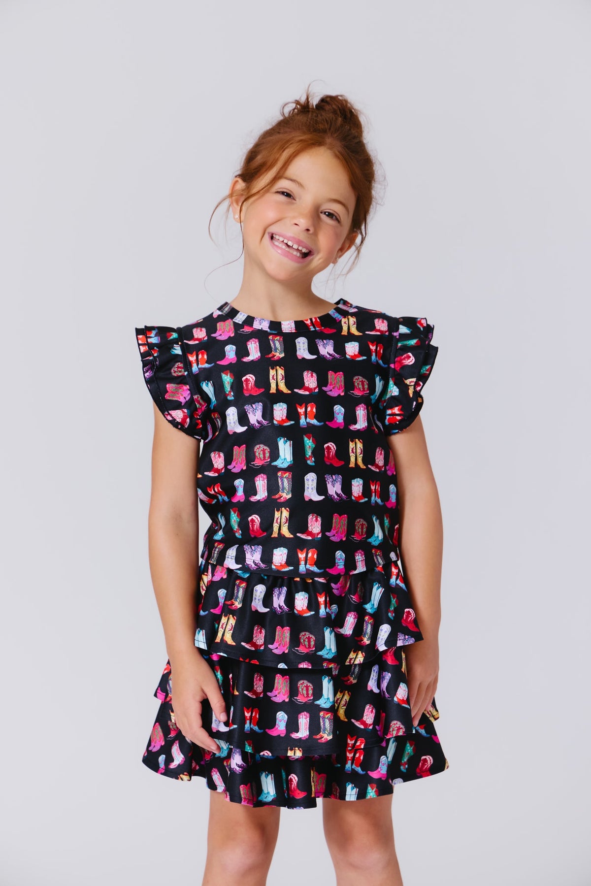 Terez Girls Hi-Shine Ruffle Crop Top in Cowgirl Boots on Black on model