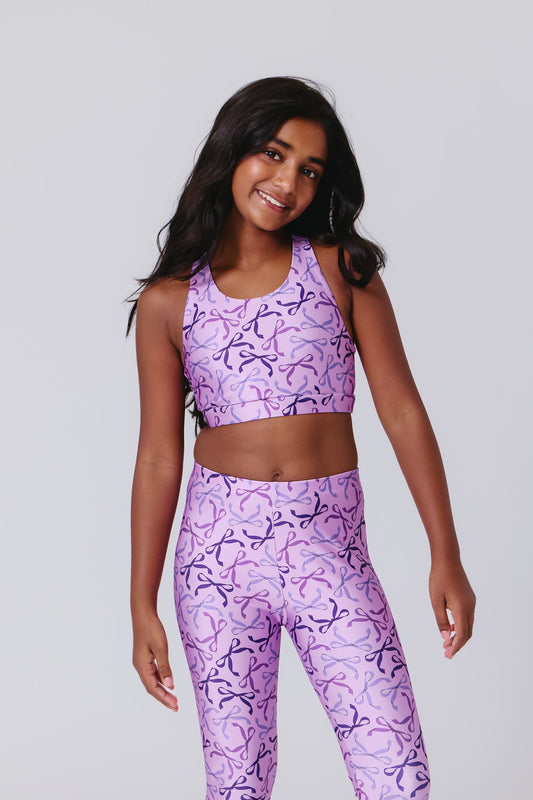 Terez Girls Hi-Shine Sports Bra in Purple Bows on model