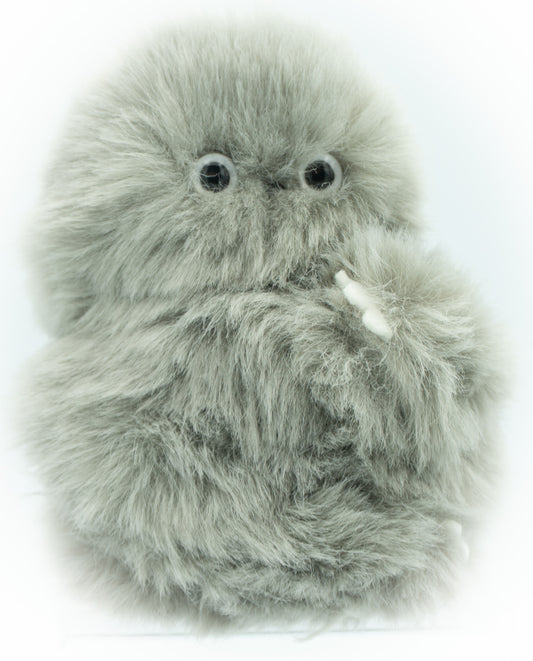 A fluffy gray robotic plush toy with large black eyes and small white claws, photographed against a plain white background.