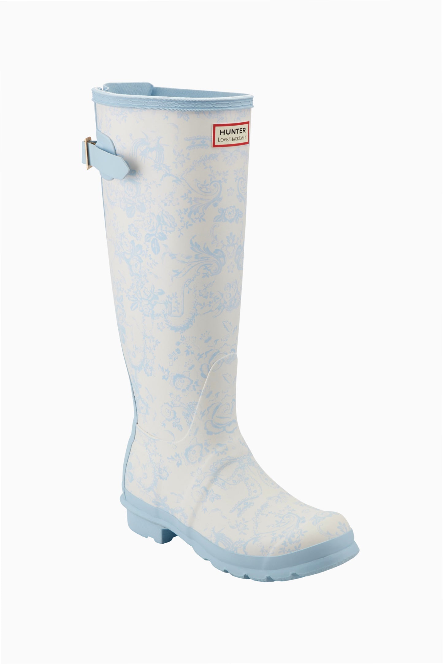 Tall white rain boot with light blue floral pattern, light blue trim, adjustable back buckle, and Hunter x LoveShackFancy logo.