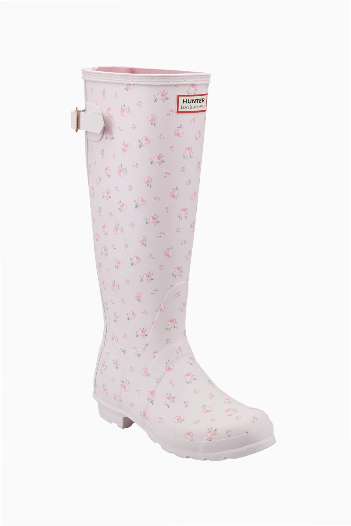 Light pink Hunter x LoveShackFancy tall rain boot with a delicate pink rose floral pattern and an adjustable back buckle.