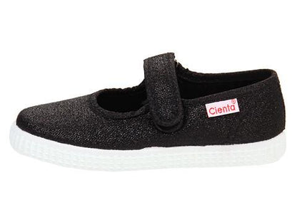 Black sparkly Mary Jane style shoe with a single hook-and-loop strap and a white rubber sole, featuring a Cienta label.