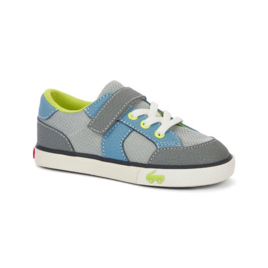 Children's grey and blue sneaker with lime green accents, a velcro strap, white laces, and a green car logo on the sole.