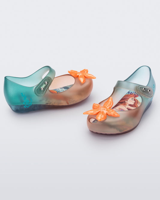 Mini Melissa Ultragirl Little Mermaid baby flats in Clear/Orange/Green with orange flower detail