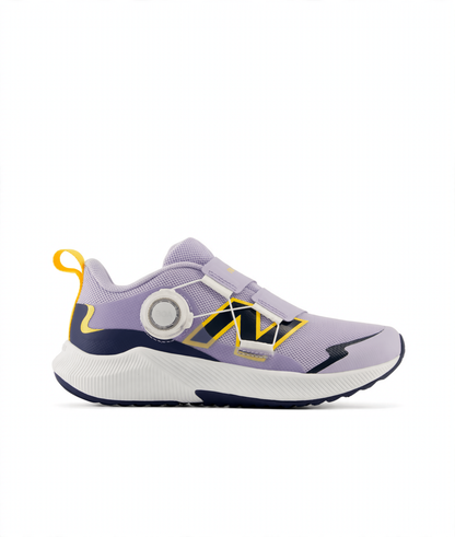 Lavender and navy blue New Balance children's athletic shoe with a BOA dial, hook-and-loop straps, yellow accents, and a white sole.