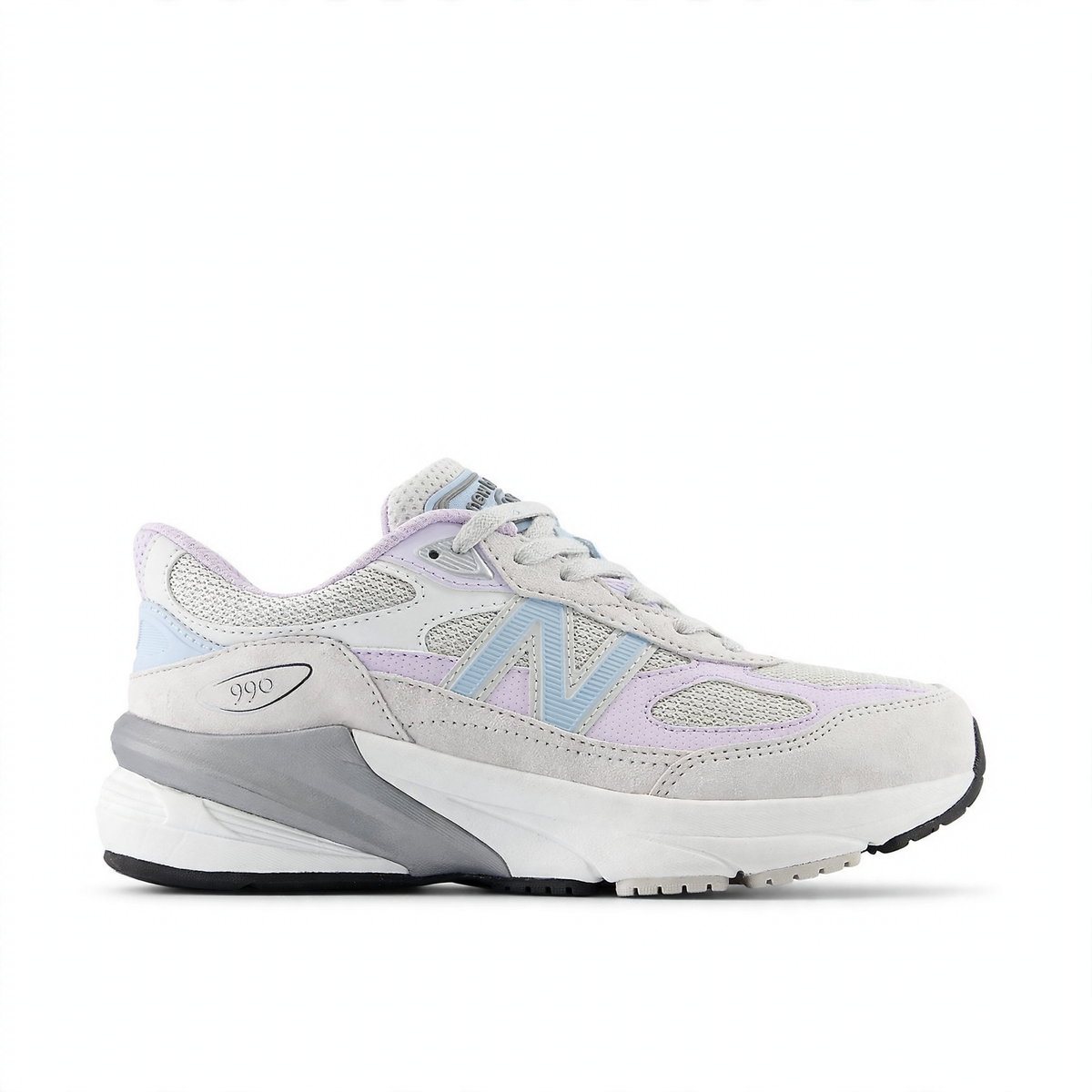 New Balance Fuelcell 990v6 big kids' sneaker in light grey, lavender, and light blue with a white midsole and black outsole.