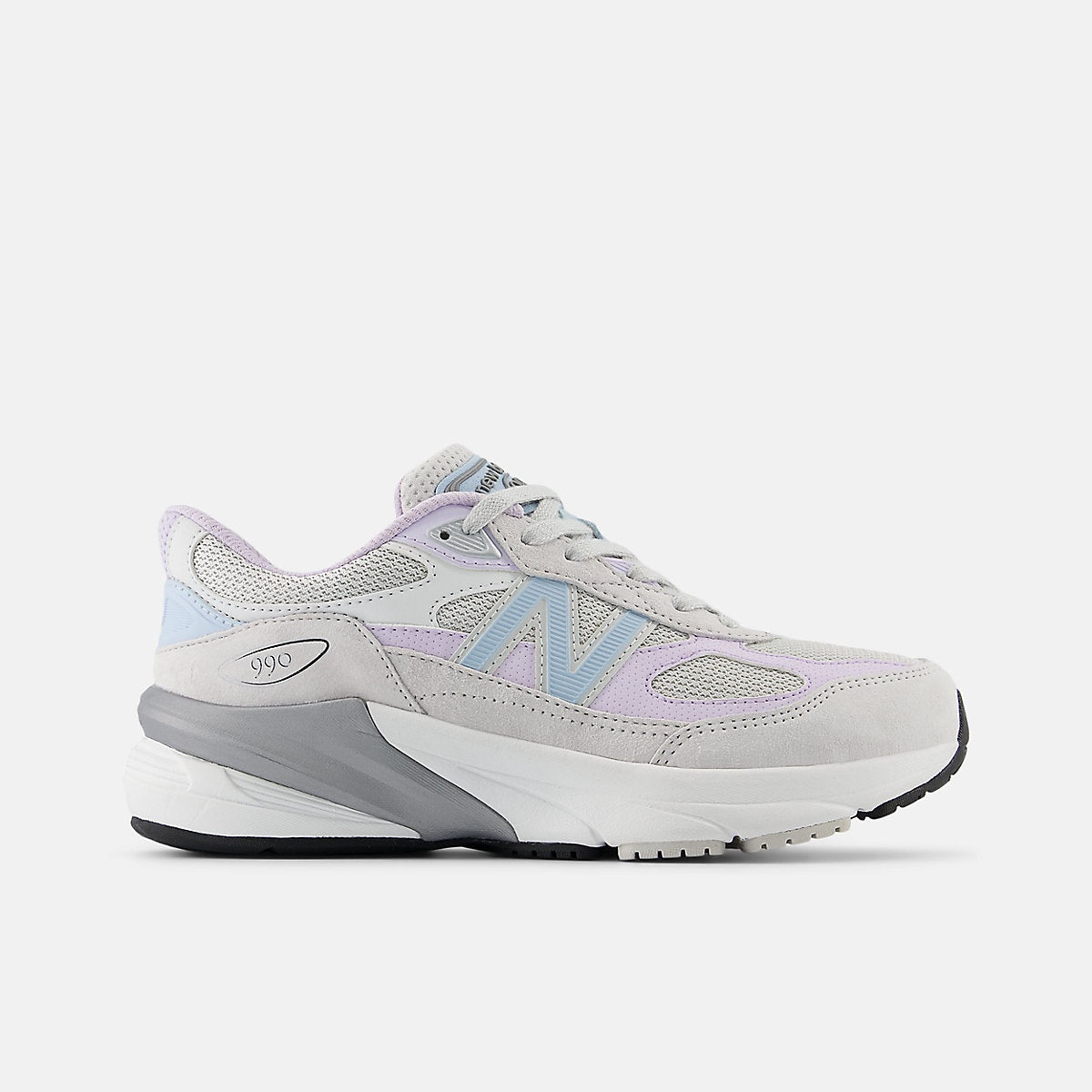 New Balance Fuelcell 990v6 big kids' sneaker in light grey, lavender, and light blue with a white midsole and black outsole.