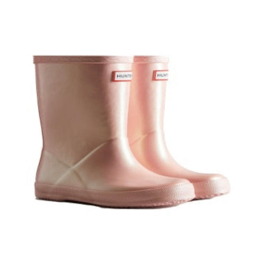 Pair of shimmery light pink Hunter Little Kids First Nebula rain boots with a short shaft and textured soles.